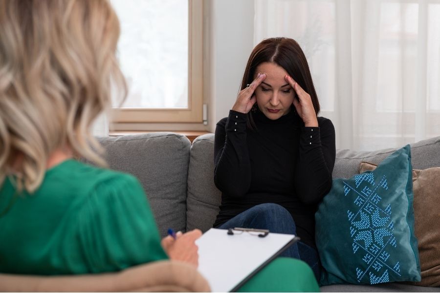 Woman on the couch in therapy during a difficult moment